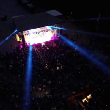 overhead shot of stage with blue light beams